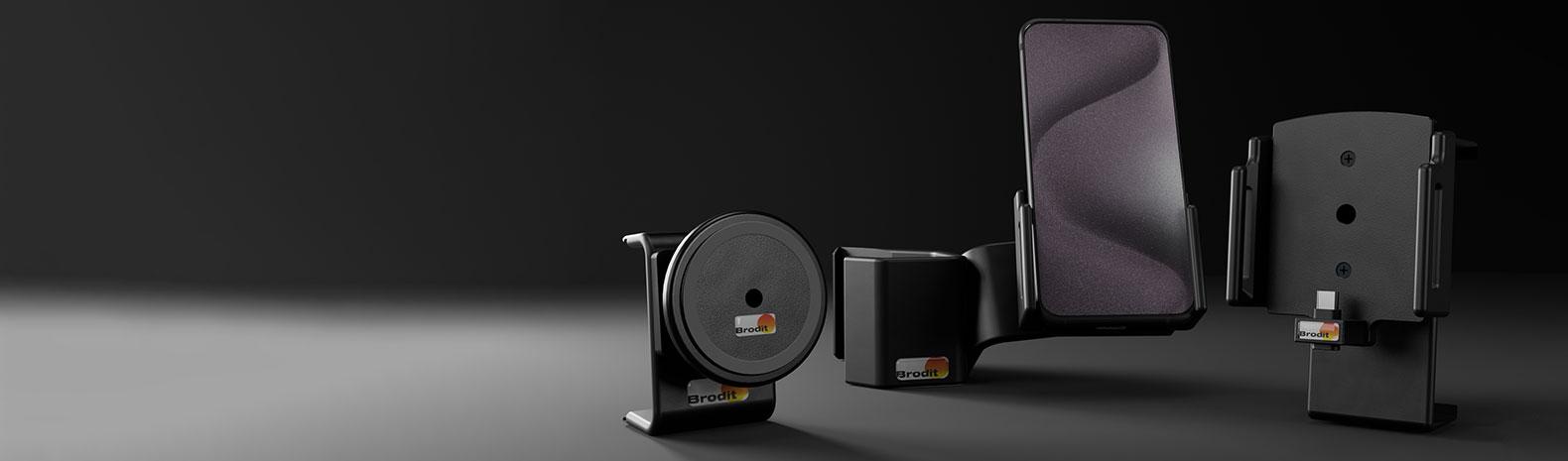 Ein Arrangement aus verschiedenen Brodit Halterungen mit einem Samsung Galaxy S24.